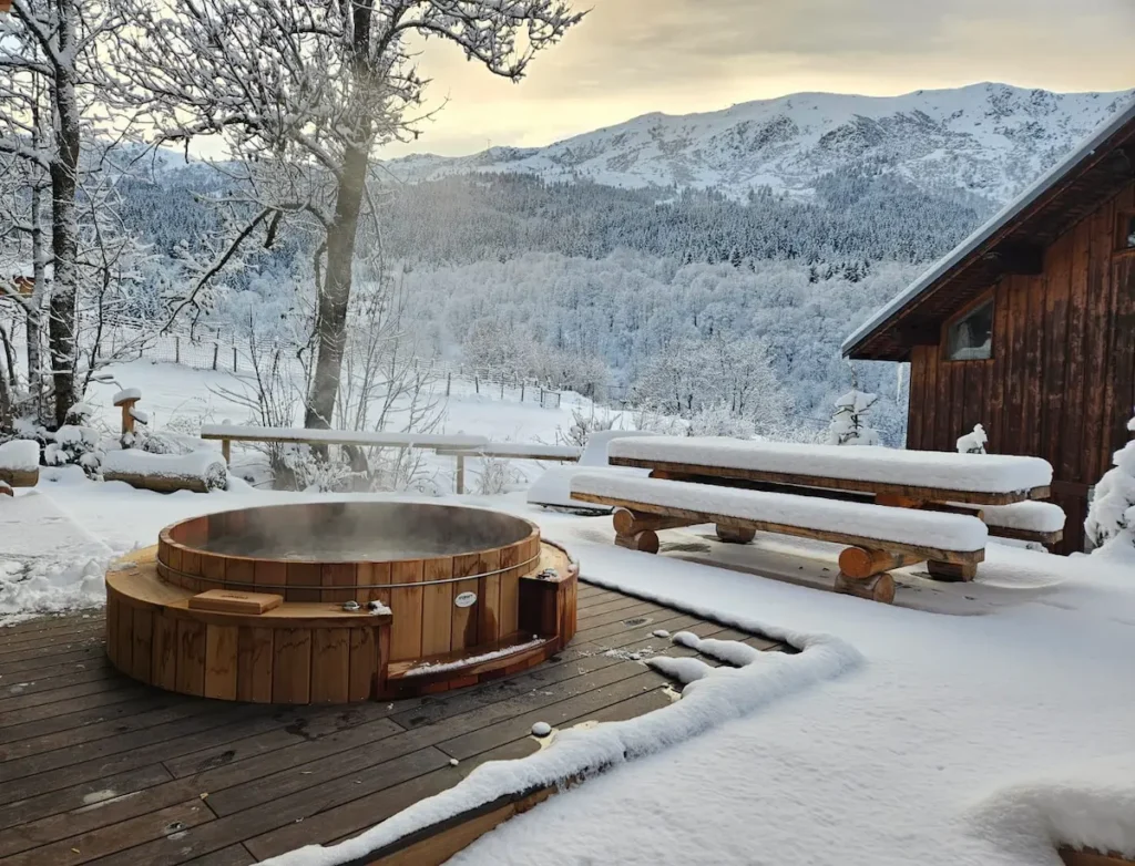 Outdoor nordic spa (hot tub) at Chalet Mussillon in Meribel. Mountain view from the spa