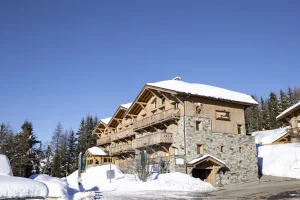 Chalets du Kandahar residence and its timber balconies facing the peaks, La Rosière