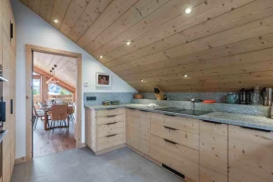 Equipped kitchen opening onto the dining room at Apartment Rhodos