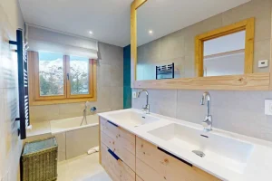 Bathroom with a double washbasin and a bathtub at Apartment Rhodos