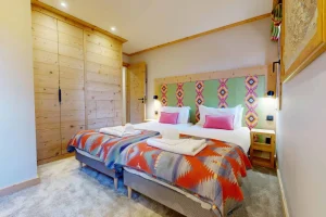 Bedroom with two beds and large timber wardrobes at Apartment Rhodos