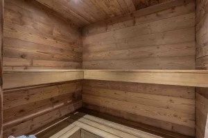 Timber sauna with tiered benches at Chalet Arnica in Les Saisies