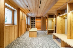 Ski room with wooden lockers and boot warmers at Chalet Brigues in Courchevel Le Praz