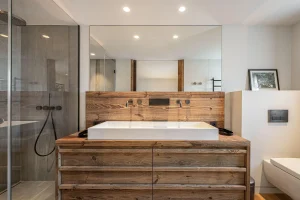 Bathroom with a rectangular washbasin, a wooden vanity unit and a walk-in shower at Chalet Merlin in Saint-Martin-de-Belleville