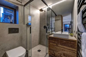 Bathroom with a basin, a walk-in shower and a towel rail