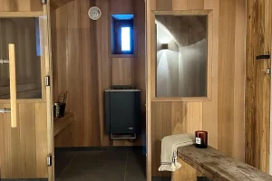 Sauna and shower area with wooden panelling