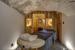 Massage table in a vaulted stone room