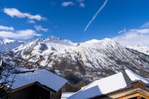 Snow-capped mountains above the village rooftops
